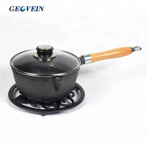 cast iron saucepan with wooden handle and  lid