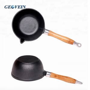 cast iron saucepan with wooden handle and  lid