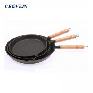 cast iron cooking pan with wooden handle