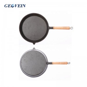 cast iron cooking pan with wooden handle