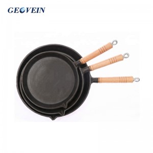 cast iron cooking pan with wooden handle